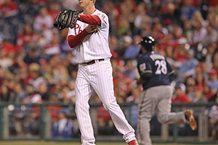 Kyle Kendrick surrendered three runs to the Brewers in the 12th inning. (Michael Bryant/Staff Photographer)