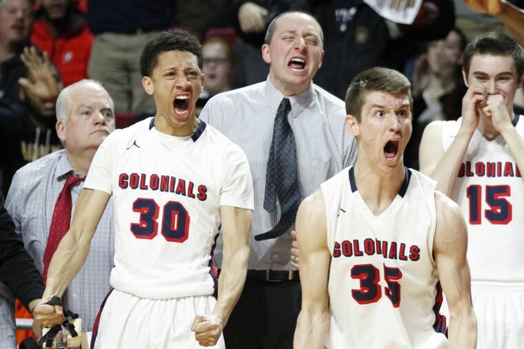 Davon Burrell, 2nd from left, and Mike Lotito #35, of Plymouth
Whitemarsh celebrate after a made basket in the 4th quarter of their
68-57 vistory over Chester in the 1st half of a District 1 AAAA Final
on Feb. 26, 2016, at Temple University's Liacouras Center.