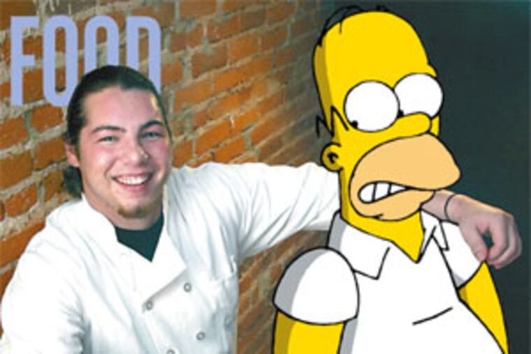 Chef Louis Mosca of Vesuvio Restaurant has Simpson food down pat. Here he displays his beer-battered fried doughnut holes and cherry dipping sauce.