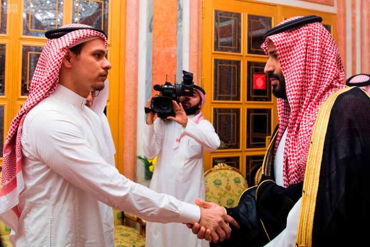 In this photo released by the Saudi Press Agency, Saudi Crown Prince Mohammed bin Salman, right, shakes hands with Salah Khashoggi, a son of Jamal Khashoggi, in Riyadh, Saudi Arabia, on Oct. 23, 2018. The meeting came just days after Saudi Arabia acknowledged that Jamal Khashoggi was killed at the Saudi consulate in Istanbul, Turkey, in what they claimed was a "fistfight." (Saudi Press Agency via AP)