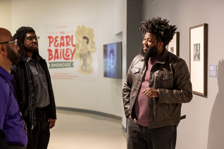 Michael K. Wilson, curator of "AAMP Presents: The Pearl Bailey Showcase," speaks to staff members at the African American Museum in Philadelphia.