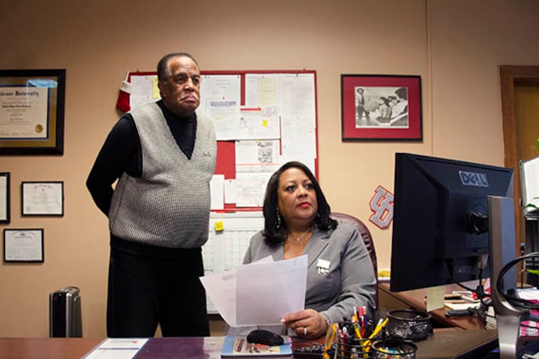 Jill Clark, Sandy Run Middle School's newest principal, sits behind her desk with her father, John Parker. Parker was the middle school's principal in the 1970s. (RACHEL WISNIEWSKI / Staff Photographer)