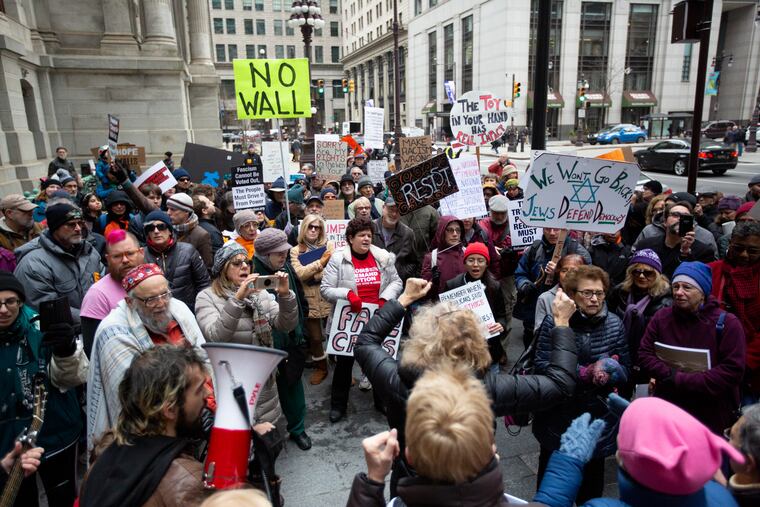 A group organized by Move On gathers at Philadelphia City Hall Monday, February 18, 2019. The Anti-Trump group gathered from Philadelphia and surrounding suburbs to stand against Trump's declaration of national emergency.