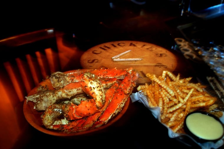 King crab legs and crab fries at the bar of Chickie’s and Pete's.