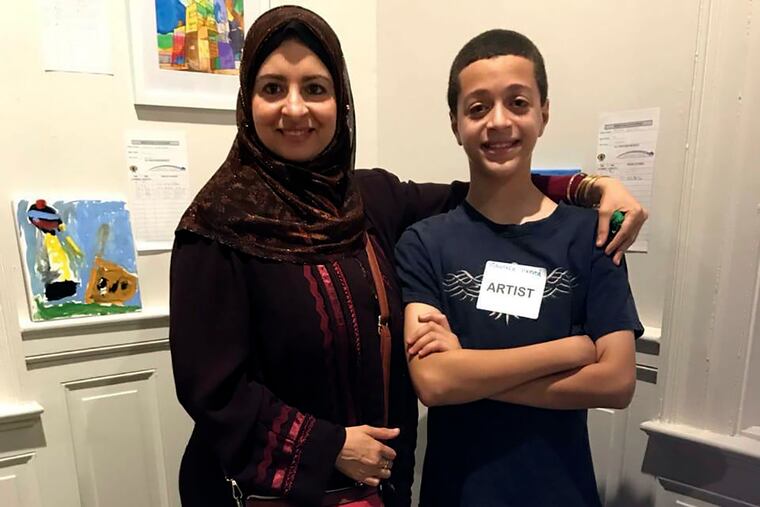 This undated photo provided by Freedom Initiative shows Reem Desouky, 47, with her 13-year-old son Mustafa Hamed at an art event in Lancaster, Pa.