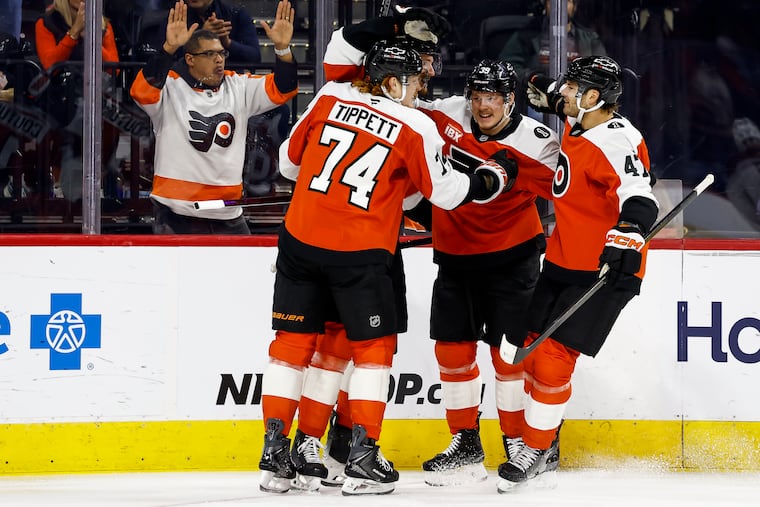 The Flyers celebrate Sean Couturier's goal to open the scoring against the Avalanche on Sunday.