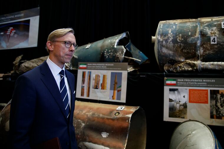 Brian Hook, U.S. special representative for Iran, walks past fragments of Iranian short range ballistic missiles (Qiam) at the Iranian Materiel Display (IMD) at Joint Base Anacostia-Bolling, in Washington, Thursday Nov. 29, 2018. The Trump administration accused Iran of stepping up violations of a U.N. ban on arms exports by sending rockets and other weaponry to rebels in Afghanistan and Yemen. The presentation displays weapons and fragments of weapons seized in Afghanistan, Bahrain and Yemen that it said are evidence Iran is a "grave and escalating threat" that must be stopped. (AP Photo/Carolyn Kaster)