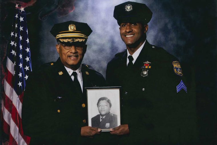 Three generations of Philadelphia policemen: Stephen T. Johnson Jr. with his father, who died of pancreatic cancer early last year, and holding a photo of his grandfather James Johnson. The son says the lawsuit isn't about the money, but about warning others.