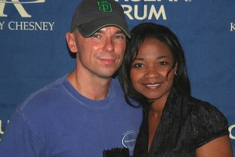 City Managing Director Loree Jones gave a Liberty Bell to singer Kenny Chesney before his show at the Linc Saturday. (See "Briefly noted.")