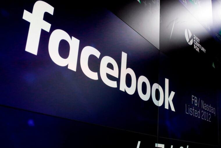 FILE – This March 29, 2018 file photo shows the Facebook logo on screens at the Nasdaq MarketSite in New York's Times Square. Facebook plummeted 19 percent Thursday, July 26, 2018, after warning of slower growth ahead, erasing more than $100 billion in value. (AP Photo/Richard Drew, File)