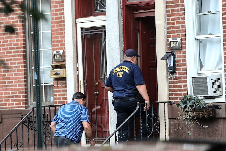 Police on the 1600 block of South 10th Street where two men were fatally shot inside a residence on Monday.