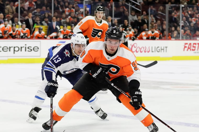 Flyers defenseman Ivan Provorov skates with the puck past Winnipeg left winger Brandon Tanev during a recent game.