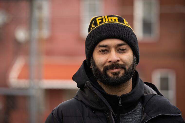 Sheldon Abba, 33, is an artist who volunteers to distribute Philabundance food every Wednesday in the parking lot of the Lillian Marrero Public Library.
