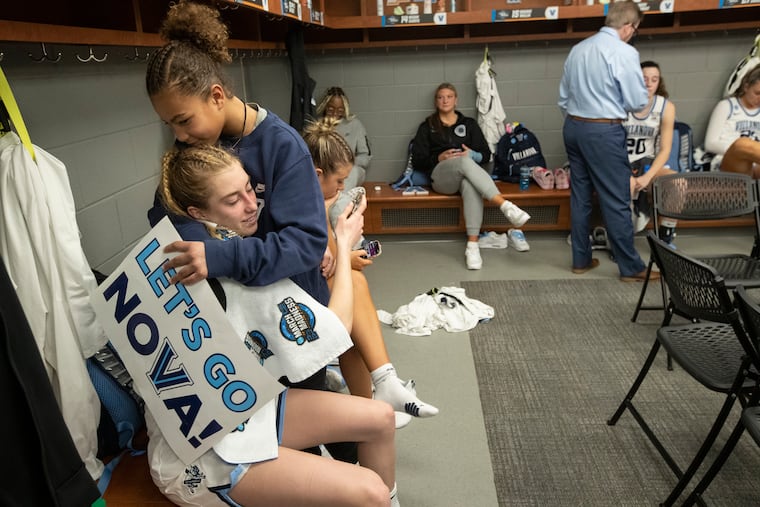 Lucy Olsen (left) of Villanova is consoled in the locker room by Haley Riley after their loss to Miami in the Sweet 16 of the NCAA women's tournament game in Greenville, South Carolina on March 24.