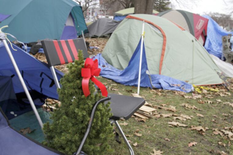 An Occupy encampment in Portland, Maine, reflects the angst of the economic climate and the hope of the season. (Pat Wellenbach / Associated Press)