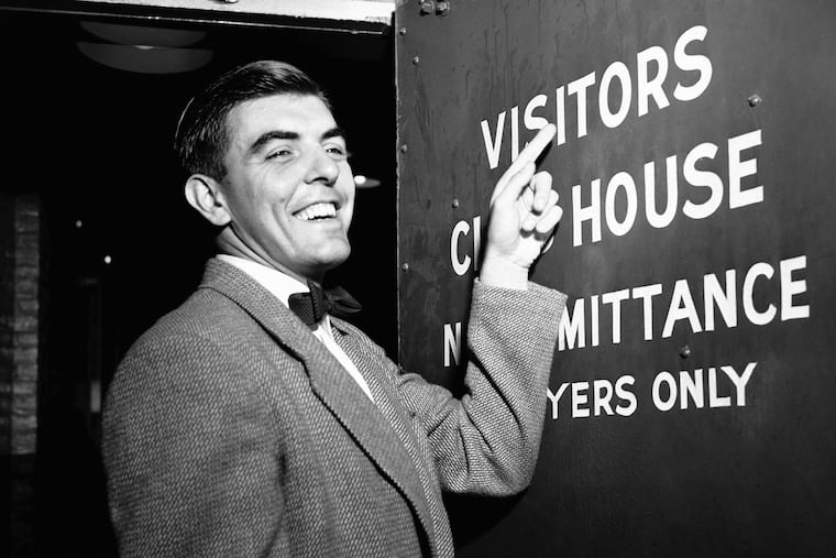Phillies pitcher Curt Simmons gestures towards a door at Ebbets Field in Brooklyn, N.Y, in 1950.