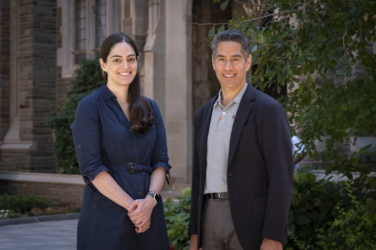 Farrah Al-Mansoor, Temple’s senior director of finance and administration, (left) and Ken Kaiser, senior vice president and chief operating officer, on Temple's campus.