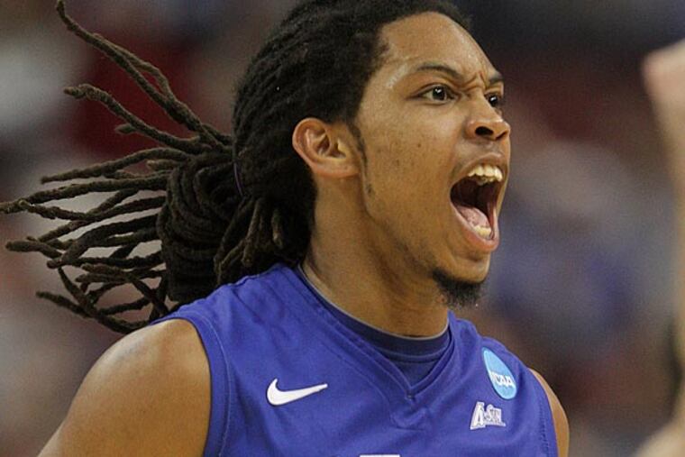 FGCU's guard Sherwood Brown (25) celebrates after hitting a three
pointer against Georgetown during the second half. FGCU beats Georgetown 78-68. (Steven M. Falk/Staff Photographer)