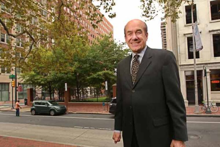 Tom Scannapieco is all smiles as he stands in the park behind Independence Hall and talks about the property behind him where he will build a luxury condo hi-rise.
