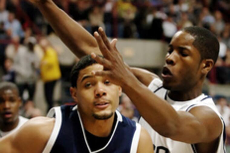UConn's Jerome Dyson defends against Scottie Reynolds.