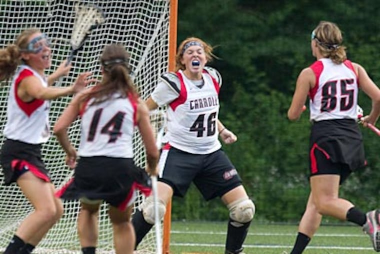 Archbishop Carroll players celebrate after their win in the Catholic League championship. (Ed Hille/Staff Photographer)