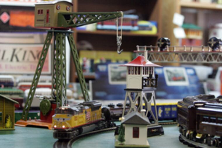 A model train layout can enchant and inspire visitors to the shop. Today's miniature trains contain microprocessors that reproduce with high clarity the sounds of yesteryear.