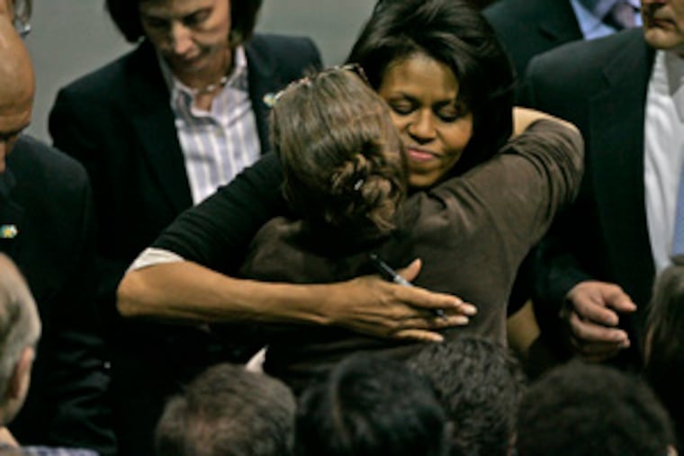 At Villanova University, a supporter hugs Obama, who decried recent harsh rhetoric. "There are millions of folks who are tired of this stuff," she said.
