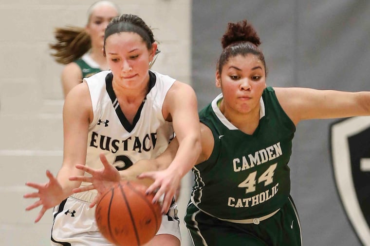 Bishop Eustace's Lauren Punk (left) fights for the ball with Camden Catholic's Eliana Santana.