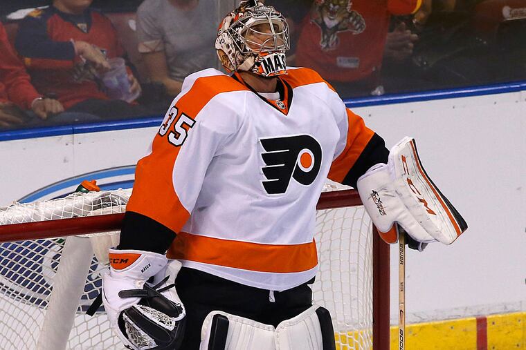 Philadelphia Flyers goalie Steve Mason (35) reacts after giving up four goals against the Florida Panthers in the first period at BB&T Center.