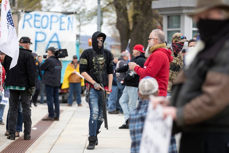 Protesters demonstrate at the state Capitol in Harrisburg, Pa., Monday, April 20, 2020, demanding that Gov. Tom Wolf reopen Pennsylvania's economy even as new social distancing mandates took effect at stores and other commercial buildings. (AP Photo/Matt Rourke)