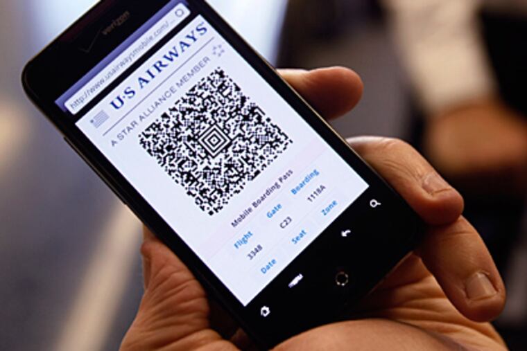 The screen of a mobile phone displays a paperless boarding pass at Philadelphia International Airport. (Michael S. Wirtz / Staff Photographer)