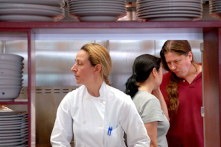 Luciana Spurio runs the kitchen at Le Virtú. Behind her are owners Catherine Lee and Francis Cratil. Just as she frequently visited the United States from Italy, they visited Italy from the United States and finally made a connection when the couple decided to open a restaurant. Cratil’s grandfather came from Abruzzi.