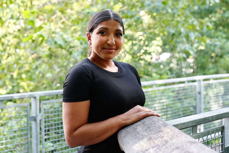 Popular Philly lifestyle influencer Cass Matthews, 31, at the Fairmount Water Works Trail & Boardwalk on Thursday, August 17, 2023.