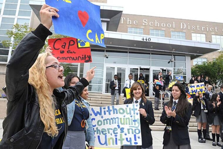 Selena Duvivier, a senior at Community Academy of Philadelphia charter school, joins a protest outside School District headquarters, where a hearing was being held on revoking the school's charter. Inside, an auditor for the district said the school had long-standing financial problems.