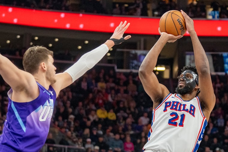 Joel Embiid looks to shoot over Utah Jazz center Walker Kessler on Saturday.