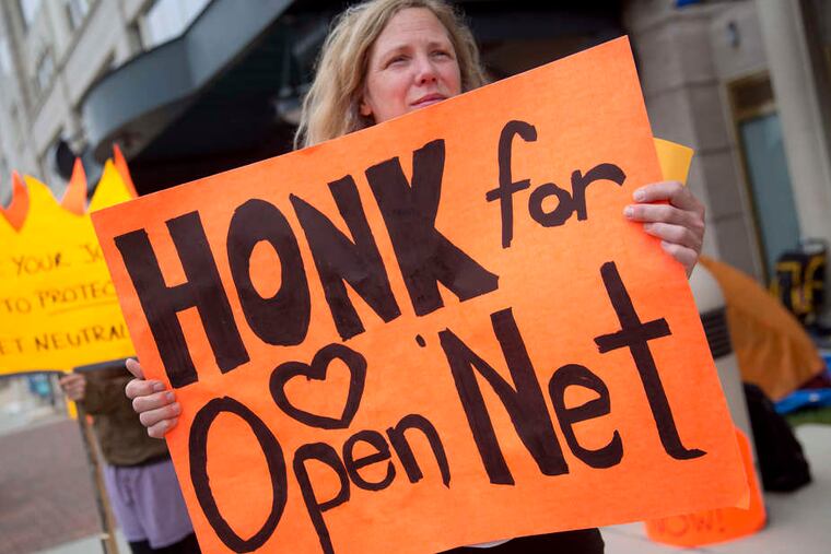 A demonstrator supporting net neutrality outside FCC offices in Washington. Last week, President Obama urged the commission to act.