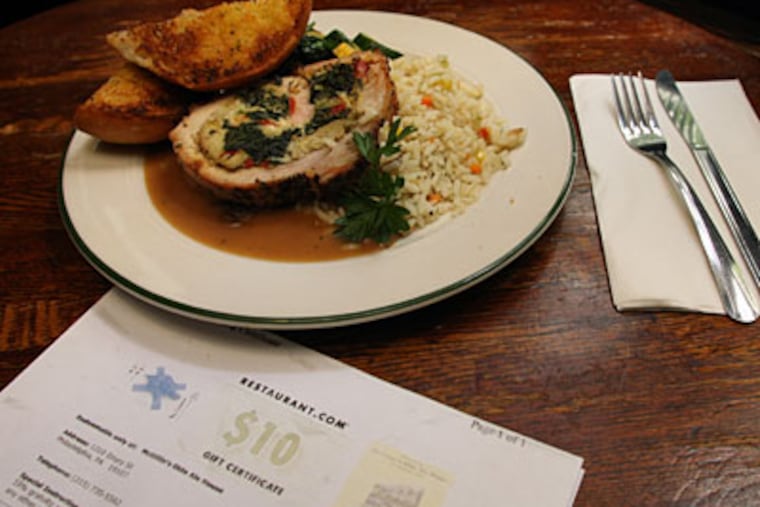 This stuffed pork roulade was bought at McGillin's Olde Ale House with an online gift certificate. (JONATHAN YU / Staff Photographer)