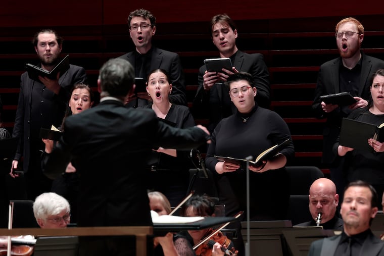 Members of the Philadelphia Symphonic Choir look to Conductor Harry Bicket as they perform Mozart Requiem with the Philadelphia Orchestra at the Kimmel Center’s Marian Anderson Hall in Philadelphia on Thursday, April 9, 2026.