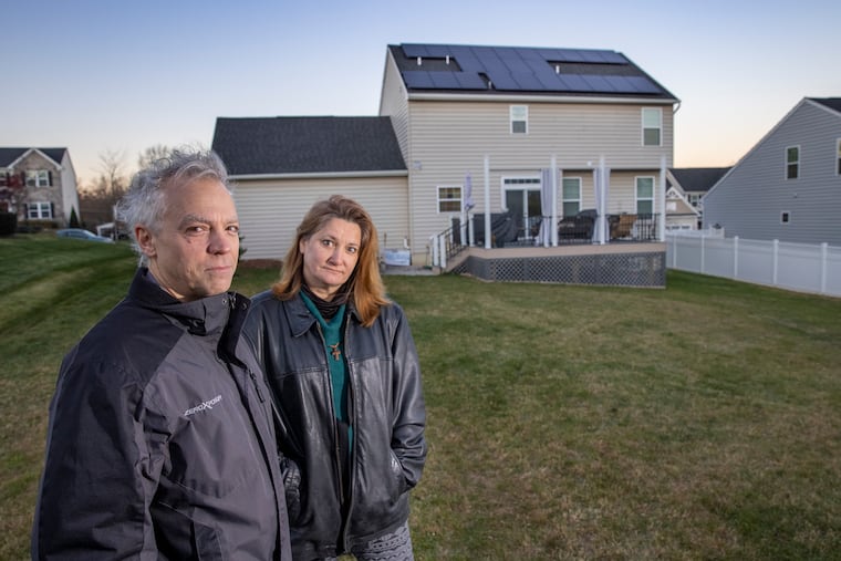 Bob and Athena Bauerle, homeowners in Sellersville, had solar panels installed on roof of their home. The family is getting pushback from some neighbors and the homeowners' association.