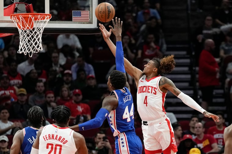 Houston Rockets guard Jalen Green (4) shoots as Paul Reed defends.