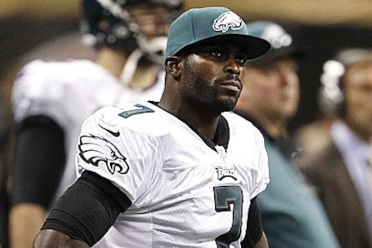 Michael Vick (7) reacts on the sideline during the second quarter of the game against the Saints. (Ron Cortes/Staff Photographer)