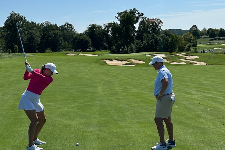 Philadelphia Cricket Club golf pro Meaghan Francella (right) teaches a golf lesson. She'll be taking the course herself this weekend at the ShopRite LPGA at Seaview Hotel and Golf Club.
