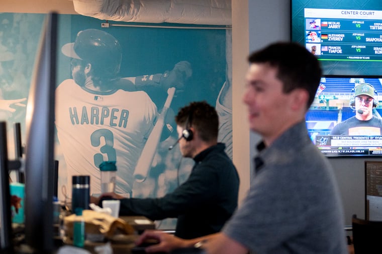 A wall of Philadelphia athletes including Bryce Harper is displayed at Kambi’s Philadelphia office. Kambi is a sports book technology company helping lead a new generation of artificial intelligence in sports betting.