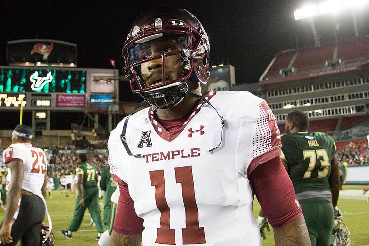 Temple Owls quarterback P.J. Walker (11) walks off the field after a game against the South Florida Bulls at Raymond James Stadium. South Florida won 44-23.