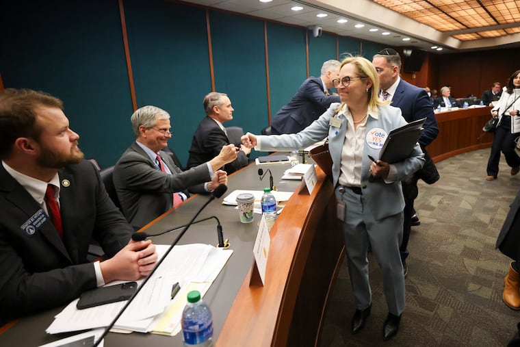 Rep. Esther Panitch, D-Sandy Springs, right, fist bumps Sen. Ben Watson, R-Savannah, a member of the Senate Judiciary Committee, after House Bill 30, an antisemitism bill, was passed unanimously by the Senate Judiciary Committee in the Coverdell Legislative Office Building last week in Atlanta.