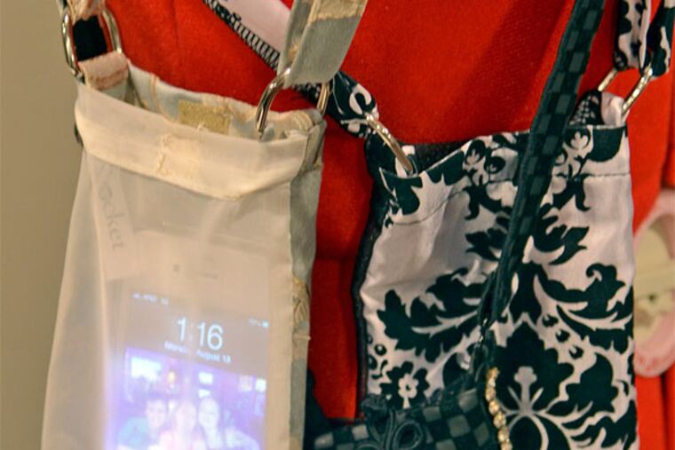 Beth Tucker's Eye-Pocket, a handy way for women to carry their cellphones free from the crowded confines of a purse. (Tom Gralish / Staff Photographer)