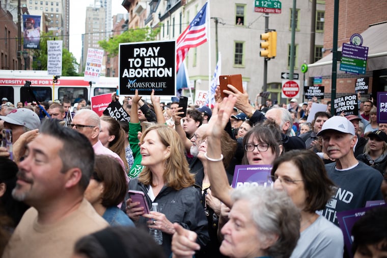 A crowd gathers in front of Planned Parenthood on Locust St. near 12th Friday, May 10, 2019. The group gathered to protest state representative, Brian Sims, whose film of himself berating some women praying on the sidewalk went viral last week.