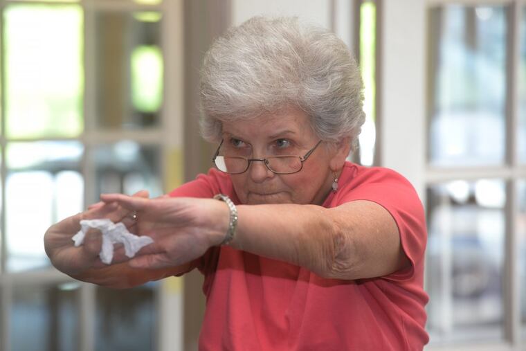 Doris Ziegler, 83, of Middletown, Dauphin County, stretches during a WISE class at GracePointe Church of Christ in Elizabethtown.