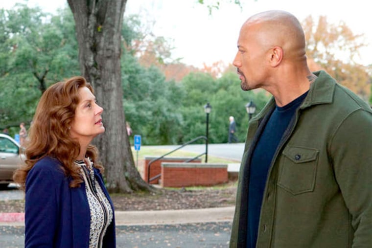Dwayne Johnson (right) deals with a U.S. attorney (Susan Sarandon) and works with a DEA agent (Barry Pepper) to keep his son out of jail.
