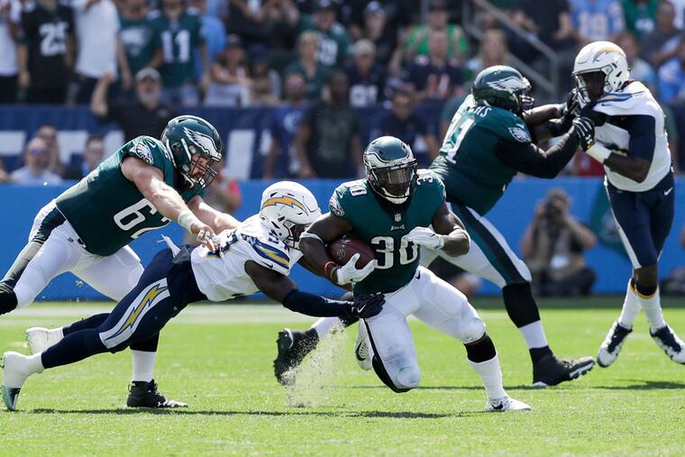 Chargers linebacker Jatavis Brown tackles Eagles running back Corey Clement in 2017.